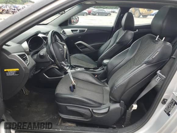 2015 Hyundai Veloster с VIN KMHTC6AD6FU233421, выставлен на аукционе Copart как лот 66420264 с пробегом 99 273 миль миль и Списание • Salvage title. История ставок и продаж доступна на DreamBid. Изображение 7.