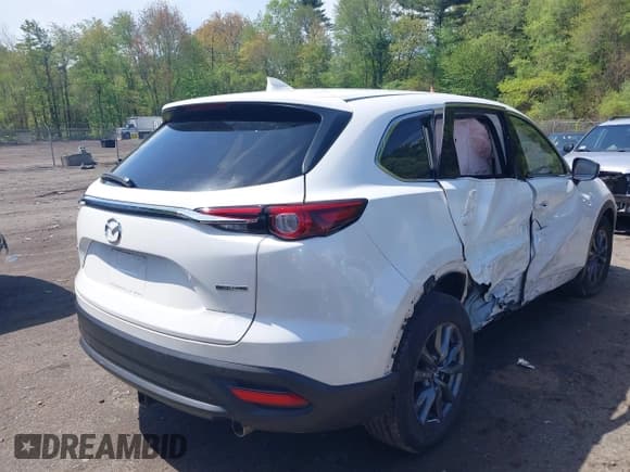 ✅ 2021 Mazda CX-9 Touring • VIN: JM3TCBCYXM0521323 • Lot: 42190976. Listed on IAAI with 56,652 mi. Free auction sales archive from the USA and detailed vehicle history report at DreamBid. Image 4.