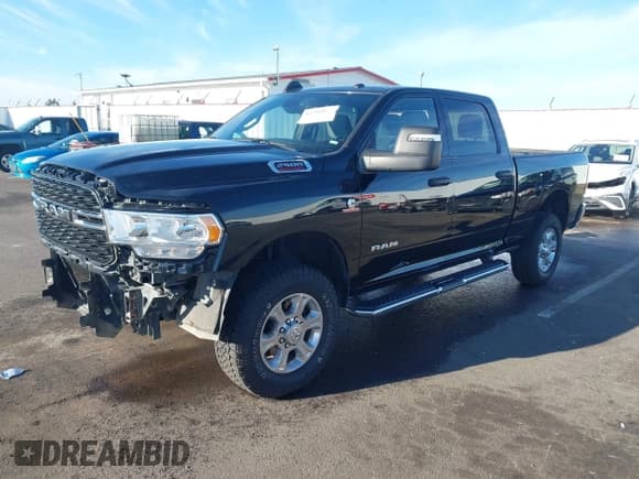 ✅ 2024 Ram 2500 Big Horn • VIN: 3C6UR5DL1RG101041 • Lot: 43784847. Listed on IAAI with 56,674 mi. Free auction sales archive from the USA and detailed vehicle history report at DreamBid. Image 2.