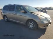✅ 2005 Honda Odyssey EX-L • VIN: 5FNRL38705B097212 • Лот: 92655085. Опубликован ранее на Copart с пробегом 162 776 миль. Бесплатный доступ к архиву аукционных продаж из США и подробный отчёт об истории автомобиля на DreamBid. Изображение 4.