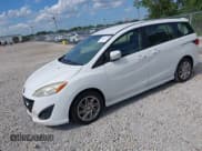 ✅ 2013 Mazda 5 Touring • VIN: JM1CW2CL5D0152097 • Lot: 42611731. Listed on IAAI with 230,179 mi. Free auction sales archive from the USA and detailed vehicle history report at DreamBid. Image 2.
