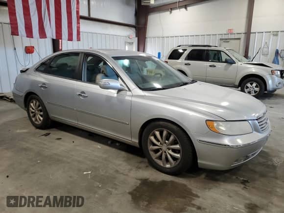 2007 Hyundai Azera SE с VIN KMHFC46F57A243839, выставлен на аукционе Copart как лот 47177895 с пробегом 271 350 миль миль и Списание • Salvage title. История ставок и продаж доступна на DreamBid. Изображение 4.