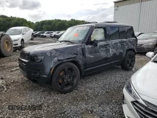 ✅ 2023 Land Rover Defender V8 • VIN: SALEWEEE6P2140647 • Лот: 66719264. Опубликован ранее на Copart с пробегом 25 077 миль. Бесплатный доступ к архиву аукционных продаж из США и подробный отчёт об истории автомобиля на DreamBid. Изображение 1.