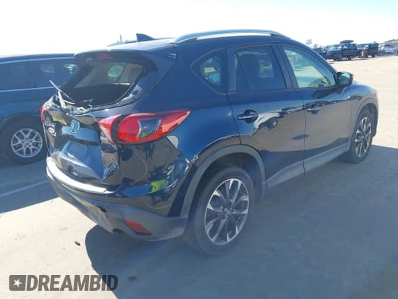 ✅ 2016 Mazda CX-5 Grand Touring • VIN: JM3KE2DY5G0715623 • Lot: 43582561. Wystawiony na IAAI z przebiegiem 166 935 mil. Bezpłatny archiwum sprzedaży aukcyjnych z USA i szczegółowy raport historii pojazdu na DreamBid. Zdjęcie 4.