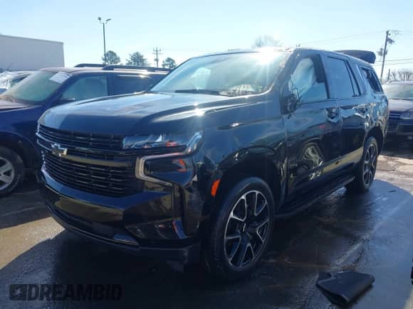 2023 Chevrolet Tahoe RST with VIN 1GNSKRKL2PR244986, listed as a IAAI auction lot 41571368 with 47,646 mi miles and . Bid and sale history available at DreamBid. Image 2.