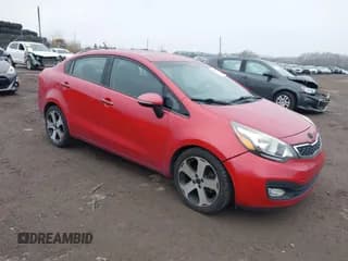 ✅ 2014 Kia Rio EX • VIN: KNADN4A3XE6397754 • Lot: 43752410. Listed on IAAI with 107,797 mi. Free auction sales archive from the USA and detailed vehicle history report at DreamBid. Image 1.