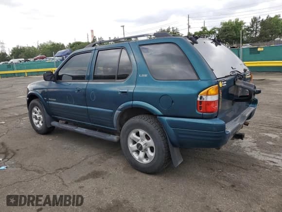 ✅ 1999 Isuzu Rodeo S • VIN: 4S2CM58W5X4313060 • Lot: 62211235. Wystawiony na Copart z przebiegiem 157 222 mil. Bezpłatny archiwum sprzedaży aukcyjnych z USA i szczegółowy raport historii pojazdu na DreamBid. Zdjęcie 2.
