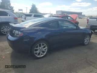 ✅ 2007 Hyundai Tiburon GT • VIN: KMHHN66F97U256039 • Лот: 82313705. Опубликован ранее на Copart с пробегом 151 935 миль. Бесплатный доступ к архиву аукционных продаж из США и подробный отчёт об истории автомобиля на DreamBid. Изображение 3.