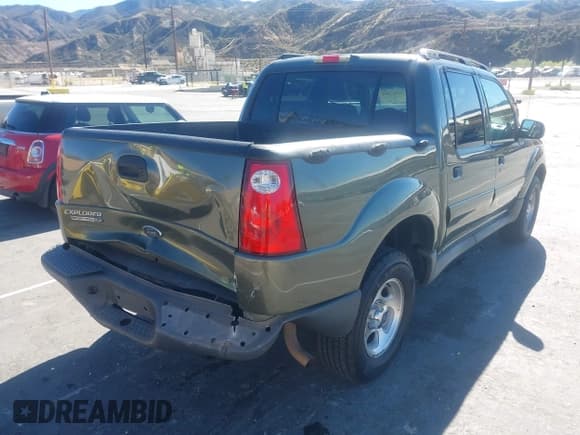 ✅ 2003 Ford Explorer Sport Trac XLS • VIN: 1FMZU67E03UB49517 • Lot: 43667081. Listed on IAAI with 309,458 mi. Free auction sales archive from the USA and detailed vehicle history report at DreamBid. Image 4.