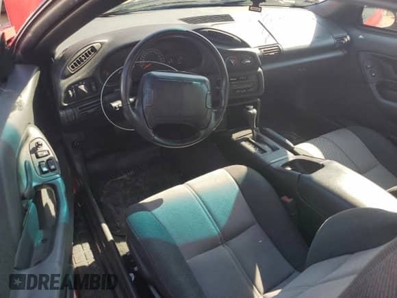 1994 Chevrolet Camaro Z28 z VIN 2G1FP22P1R2174580, wystawiony jako Copart lot #47289165 z przebiegiem 35 711 mil mil oraz Szkoda całkowita • Salvage title. Historia ofert i sprzedaży dostępna na DreamBid. Obrazek 8.