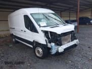 ✅ 2023 Ford Transit Cargo • VIN: 1FTBR1C80PKA87676 • Lot: 43761257. Listed on IAAI with 27,765 mi. Free auction sales archive from the USA and detailed vehicle history report at DreamBid. Image 1.