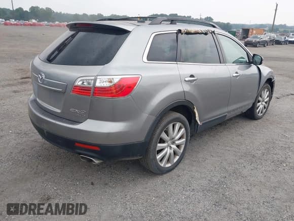 ✅ 2010 Mazda CX-9 Touring • VIN: JM3TB3MV9A0210975 • Lot: 42935060. Listed on IAAI with 180,993 mi. Free auction sales archive from the USA and detailed vehicle history report at DreamBid. Image 4.