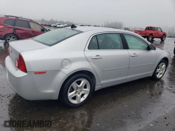 ✅ 2012 Chevrolet Malibu 1LS • VIN: 1G1ZB5E0XCF228055 • Lot: 82209343. Listed on Copart with 105,148 mi. Free auction sales archive from the USA and detailed vehicle history report at DreamBid. Image 3.