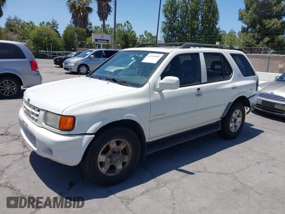 ✅ 1999 Isuzu Rodeo S • VIN: 4S2CK58W1X4344442 • Lot: 42519582. Listed on IAAI with 185,098 mi. Free auction sales archive from the USA and detailed vehicle history report at DreamBid. Image 2.