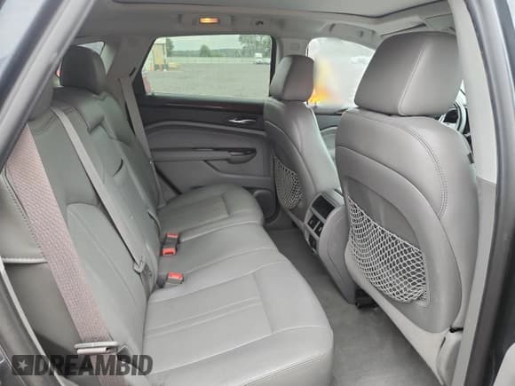 ✅ 2012 Cadillac SRX Performance Collection • VIN: 3GYFNBE30CS598950 • Lot: 81205505. Listed on Copart with 96,413 mi. Free auction sales archive from the USA and detailed vehicle history report at DreamBid. Image 11.