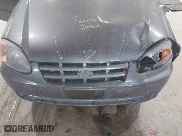 2004 Hyundai Accent GL z VIN KMHCG45C44U528783, wystawiony jako IAAI lot #41535104 z przebiegiem Nie podano mil oraz . Historia ofert i sprzedaży dostępna na DreamBid. Obrazek 10.