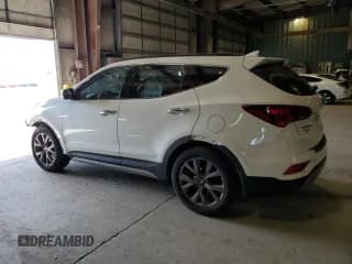 ✅ 2018 Hyundai Santa Fe Ultimate • VIN: 5NMZWDLA6JH054390 • Лот: 59157344. Опубликован ранее на Copart с пробегом 71 582 миль. Бесплатный доступ к архиву аукционных продаж из США и подробный отчёт об истории автомобиля на DreamBid. Изображение 2.