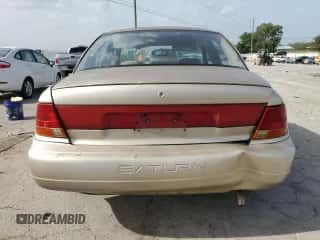 1998 Saturn SL z VIN 1G8ZK5270WZ240303, wystawiony jako Copart lot #65364164 z przebiegiem 156 699 mil mil oraz Szkoda całkowita • Salvage title. Historia ofert i sprzedaży dostępna na DreamBid. Obrazek 6.