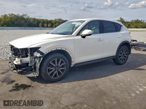 ✅ 2018 Mazda CX-5 Grand Touring • VIN: JM3KFBDM8J0310082 • Lot: 94713205. Listed on Copart with 70,962 mi. Free auction sales archive from the USA and detailed vehicle history report at DreamBid. Image 1.