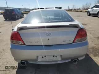 2006 Hyundai Tiburon GT z VIN KMHHN65F76U190851, wystawiony jako Copart lot #45935795 z przebiegiem 102 335 mil mil oraz Szkoda całkowita • Salvage title. Historia ofert i sprzedaży dostępna na DreamBid. Obrazek 6.
