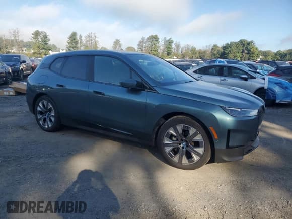 ✅ 2023 BMW iX xDrive50 • VIN: WB523CF05PCM28076 • Lot: 84243555. Listed on Copart with 44,064 mi. Free auction sales archive from the USA and detailed vehicle history report at DreamBid. Image 4.