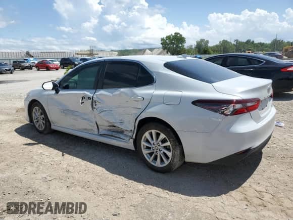2022 Toyota Camry LE с VIN 4T1R11BK7NU055288, выставлен на аукционе Copart как лот 67012075 с пробегом 106 728 миль миль и Списание • Salvage title. История ставок и продаж доступна на DreamBid. Изображение 2.