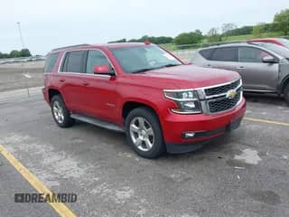 2015 Chevrolet Tahoe LT z VIN 1GNSKBKCXFR599393, wystawiony jako IAAI lot #42927250 z przebiegiem 103 370 mil mil oraz . Historia ofert i sprzedaży dostępna na DreamBid. Obrazek 1.