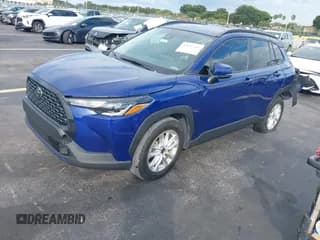 ✅ 2022 Toyota Corolla Cross LE • VIN: 7MUCAAAG9NV009110 • Lot: 43637345. Listed on IAAI with 32,257 mi. Free auction sales archive from the USA and detailed vehicle history report at DreamBid. Image 2.