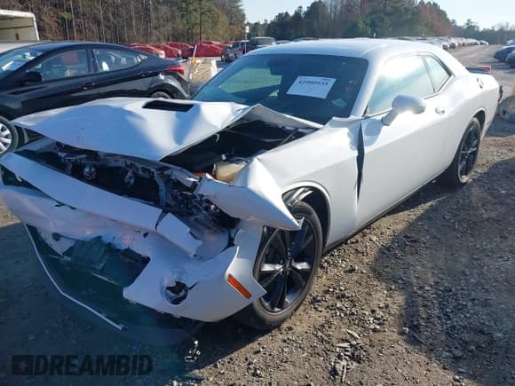 ✅ 2022 Dodge Challenger SXT • VIN: 2C3CDZGG2NH219395 • Lot: 41000935. Listed on IAAI with 22,551 mi. Free auction sales archive from the USA and detailed vehicle history report at DreamBid. Image 18.
