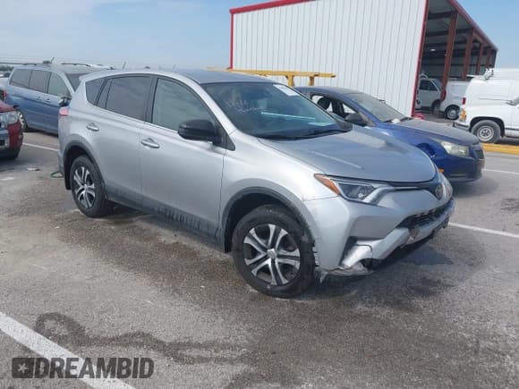 ✅ 2018 Toyota RAV4 LE • VIN: 2T3ZFREV8JW515775 • Lot: 43433663. Listed on IAAI with 124,038 mi. Free auction sales archive from the USA and detailed vehicle history report at DreamBid. Image 1.