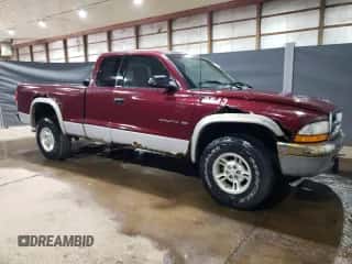 2000 Dodge Dakota Sport z VIN 1B7GG22NXYS573079, wystawiony jako Copart lot #66582204 z przebiegiem 128 435 mil mil oraz Czysty tytuł • Clean title. Historia ofert i sprzedaży dostępna na DreamBid. Obrazek 4.