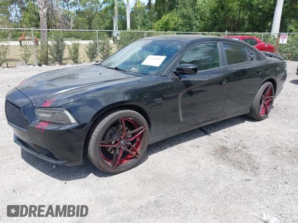✅ 2013 Dodge Charger SXT Plus • VIN: 2C3CDXJG1DH584579 • Lot: 42128401. Listed on IAAI with 100,388 mi. Free auction sales archive from the USA and detailed vehicle history report at DreamBid. Image 19.