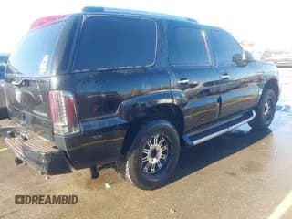 ✅ 2003 Cadillac Escalade • VIN: 1GYEK63N33R262308 • Lot: 43624184. Wystawiony na IAAI z przebiegiem 272 754 mil. Bezpłatny archiwum sprzedaży aukcyjnych z USA i szczegółowy raport historii pojazdu na DreamBid. Zdjęcie 4.
