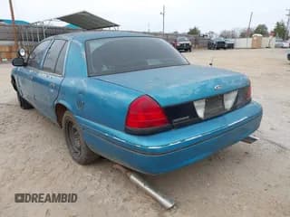 ✅ 2000 Ford Crown Victoria Police Interceptor • VIN: 2FAFP71W4YX136846 • Лот: 41715363. Опубликован ранее на IAAI с пробегом 335 956 миль. Бесплатный доступ к архиву аукционных продаж из США и подробный отчёт об истории автомобиля на DreamBid. Изображение 3.