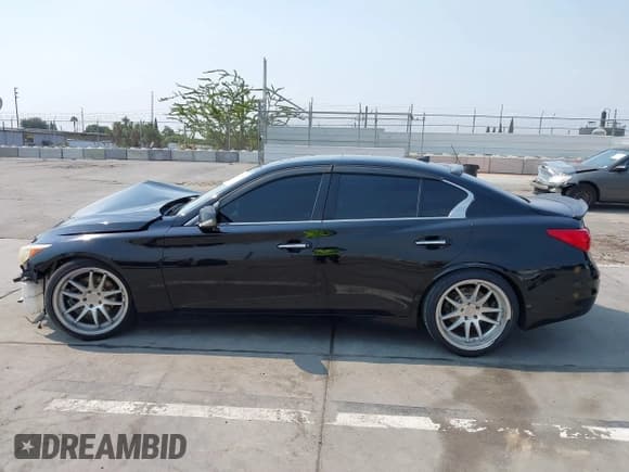 ✅ 2014 Infiniti Q50 • VIN: JN1BV7AP0EM678572 • Lot: 42828079. Listed on IAAI with 171,854 mi. Free auction sales archive from the USA and detailed vehicle history report at DreamBid. Image 14.