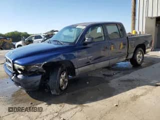 2002 Dodge Dakota Sport z VIN 1B7HL38X42S589588, wystawiony jako Copart lot #75025304 z przebiegiem 262 560 mil mil oraz Szkoda całkowita • Salvage title. Historia ofert i sprzedaży dostępna na DreamBid. Obrazek 1.