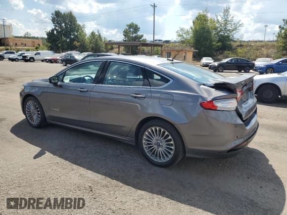 ✅ 2013 Ford Fusion Titanium Hybrid • VIN: 3FA6P0RU0DR308700 • Лот: 80861785. Опубликован ранее на Copart с пробегом 105 588 миль. Бесплатный доступ к архиву аукционных продаж из США и подробный отчёт об истории автомобиля на DreamBid. Изображение 2.