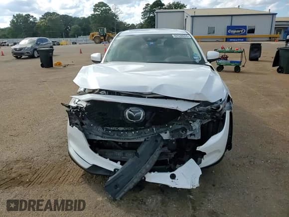 ✅ 2021 Mazda CX-5 Grand Touring • VIN: JM3KFBDMXM0330354 • Лот: 82538655. Опубликован ранее на Copart с пробегом 80 734 миль. Бесплатный доступ к архиву аукционных продаж из США и подробный отчёт об истории автомобиля на DreamBid. Изображение 14.
