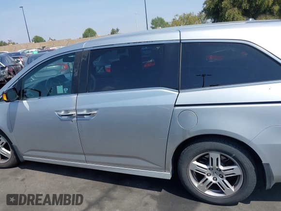 ✅ 2012 Honda Odyssey Touring • VIN: 5FNRL5H91CB004546 • Lot: 42175002. Listed on IAAI with 118,719 mi. Free auction sales archive from the USA and detailed vehicle history report at DreamBid. Image 14.
