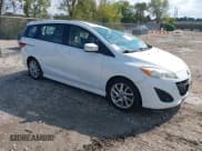 ✅ 2013 Mazda 5 Touring • VIN: JM1CW2CLXD0151396 • Lot: 40479013. Listed on IAAI with 118,314 mi. Free auction sales archive from the USA and detailed vehicle history report at DreamBid. Image 1.