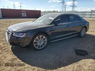 ✅ 2015 Audi A8 4.0T • VIN: WAU32AFD4FN007582 • Lot: 90603055. Listed on Copart with 137,859 mi. Free auction sales archive from the USA and detailed vehicle history report at DreamBid. Image 1.