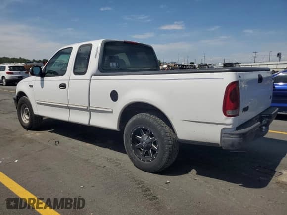 ✅ 1997 Ford F-150 XL • VIN: 1FTEX17L9VKB79741 • Lot: 60880145. Listed on Copart with 163,643 mi. Free auction sales archive from the USA and detailed vehicle history report at DreamBid. Image 2.