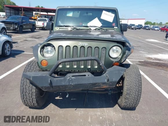 ✅ 2007 Jeep Wrangler Unlimited Sahara • VIN: 1J4GA59157L198095 • Lot: 43011519. Listed on IAAI with 198,022 mi. Free auction sales archive from the USA and detailed vehicle history report at DreamBid. Image 12.