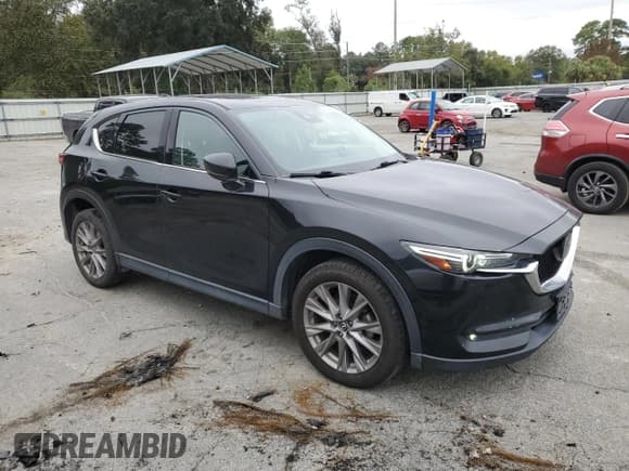 ✅ 2019 Mazda CX-5 Grand Touring • VIN: JM3KFBDM9K0549030 • Лот: 82774585. Опубликован ранее на Copart с пробегом 74 307 миль. Бесплатный доступ к архиву аукционных продаж из США и подробный отчёт об истории автомобиля на DreamBid. Изображение 4.