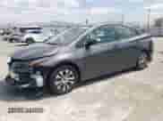 2021 Toyota Prius LE z VIN JTDKAMFP7M3176372, wystawiony jako Copart lot #68893794 z przebiegiem 59 421 mil mil oraz Szkoda całkowita • Salvage title. Historia ofert i sprzedaży dostępna na DreamBid. Obrazek 1.
