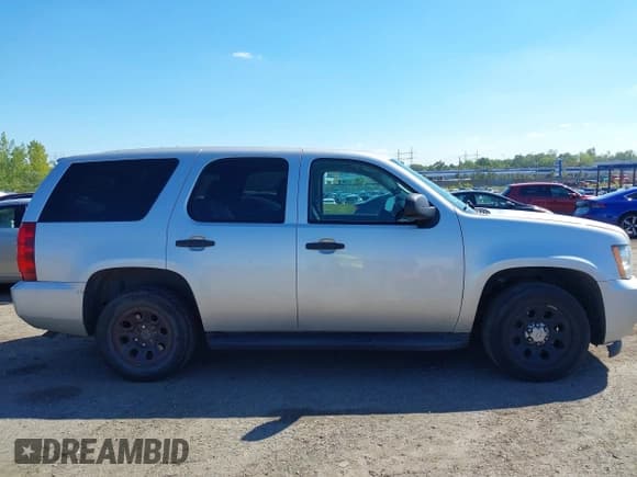 ✅ 2014 Chevrolet Tahoe Commercial • VIN: 1GNLC2E09ER207067 • Lot: 43268966. Listed on IAAI with 227,117 mi. Free auction sales archive from the USA and detailed vehicle history report at DreamBid. Image 13.