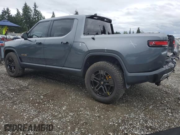 ✅ 2023 Rivian R1T Adventure • VIN: 7FCTGAAA7PN023885 • Lot: 68702645. Listed on Copart with 34,990 mi. Free auction sales archive from the USA and detailed vehicle history report at DreamBid. Image 2.