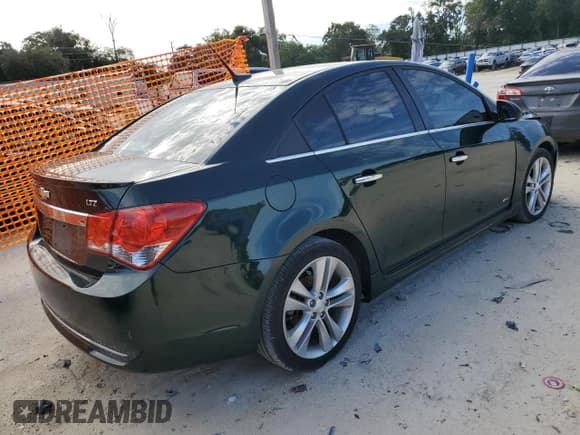 ✅ 2014 Chevrolet Cruze LTZ • VIN: 1G1PG5SB4E7166499 • Lot: 71042705. Listed on Copart with 197,470 mi. Free auction sales archive from the USA and detailed vehicle history report at DreamBid. Image 3.