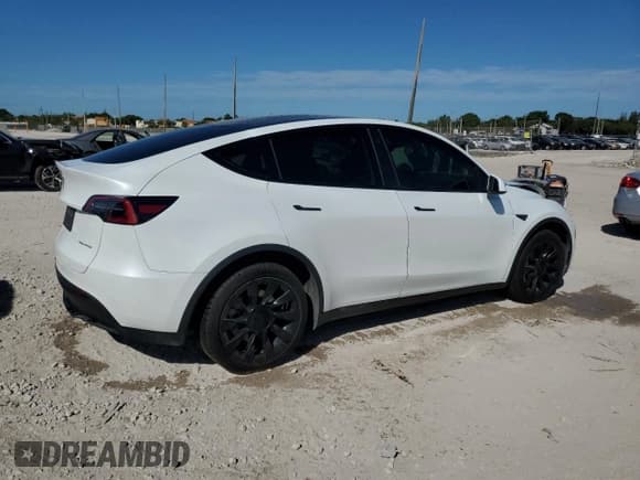 ✅ 2023 Tesla Model Y Long Range • VIN: 7SAYGDEE4PA025098 • Lot: 90648895. Listed on Copart with 34,569 mi. Free auction sales archive from the USA and detailed vehicle history report at DreamBid. Image 3.