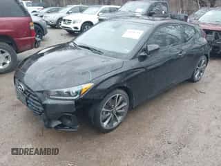 2019 Hyundai Veloster Premium z VIN KMHTG6AF0KU019038, wystawiony jako IAAI lot #41236750 z przebiegiem 83 164 mil mil oraz . Historia ofert i sprzedaży dostępna na DreamBid. Obrazek 2.